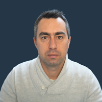 A photo of my face against a blue background.